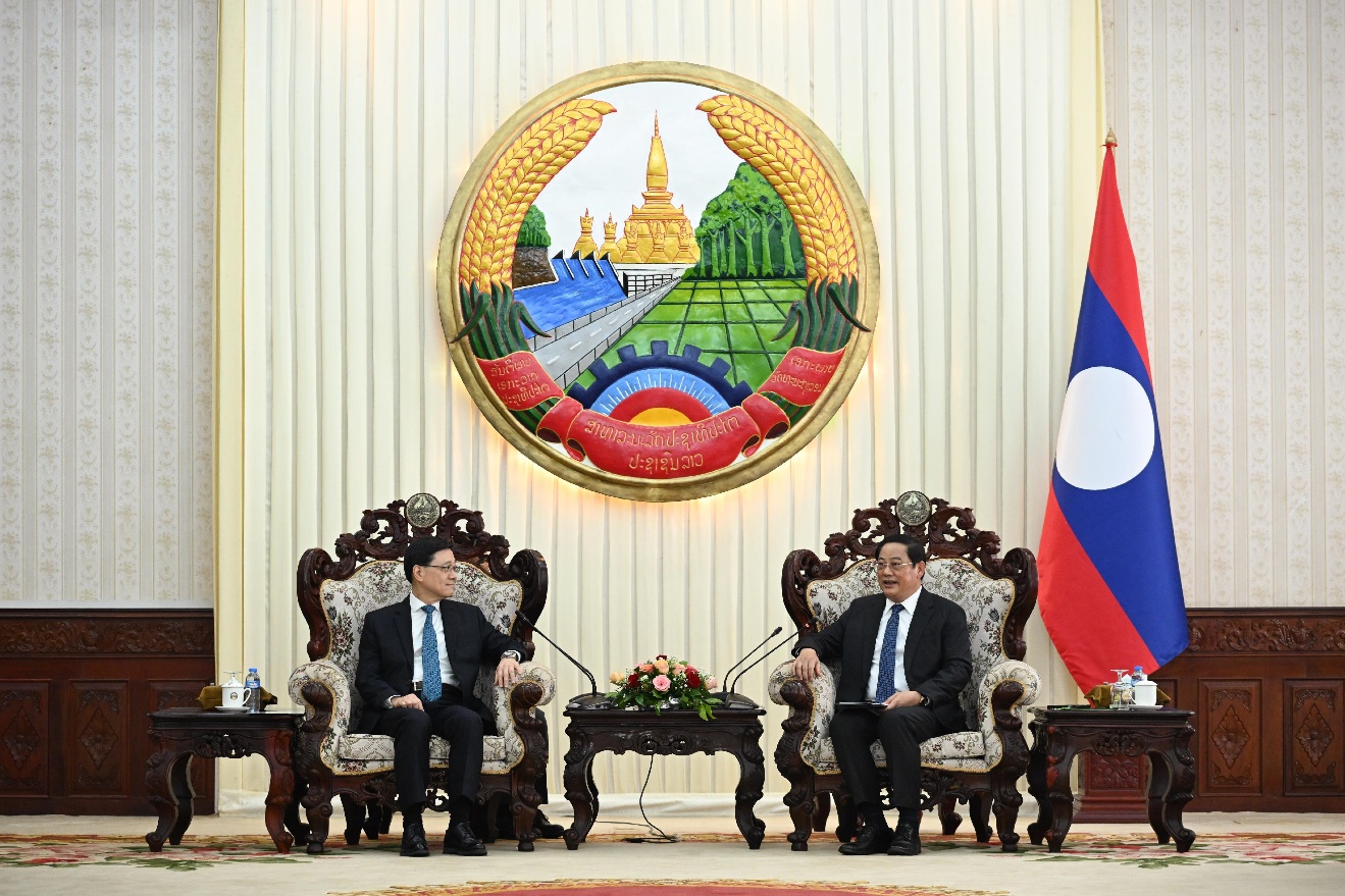 Hong Kong's Chief Executive John Lee (left) meets Laos Prime Minister Sonexay Siphandone.