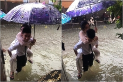 Bức ảnh chú rể cõng cô dâu trong trận lụt lịch sử ở Vinh bỗng dưng nổi tiếng