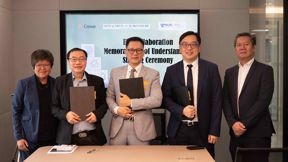 The MOU signing ceremony took place on Friday, 19 May 2023 at Donaldson & Burkinshaw's office. (From second left) Professor Lawrence Loh, Director of the National University of Singapore Centre for Governance and Sustainability, Mr. Linus Ng Siew Hong, Partner at Donaldson & Burkinshaw and Mr. Chia Shu Siang, Head of Sustainability & Climate Change at Crowe Singapore signed the MOU. Ms. Gooi Chi Duan, Partner at Donaldson & Burkinshaw (left) and Mr. Alfred Cheong, Deputy Chief Executive Officer at Crowe Singapore (right) witnessed the signing ceremony.