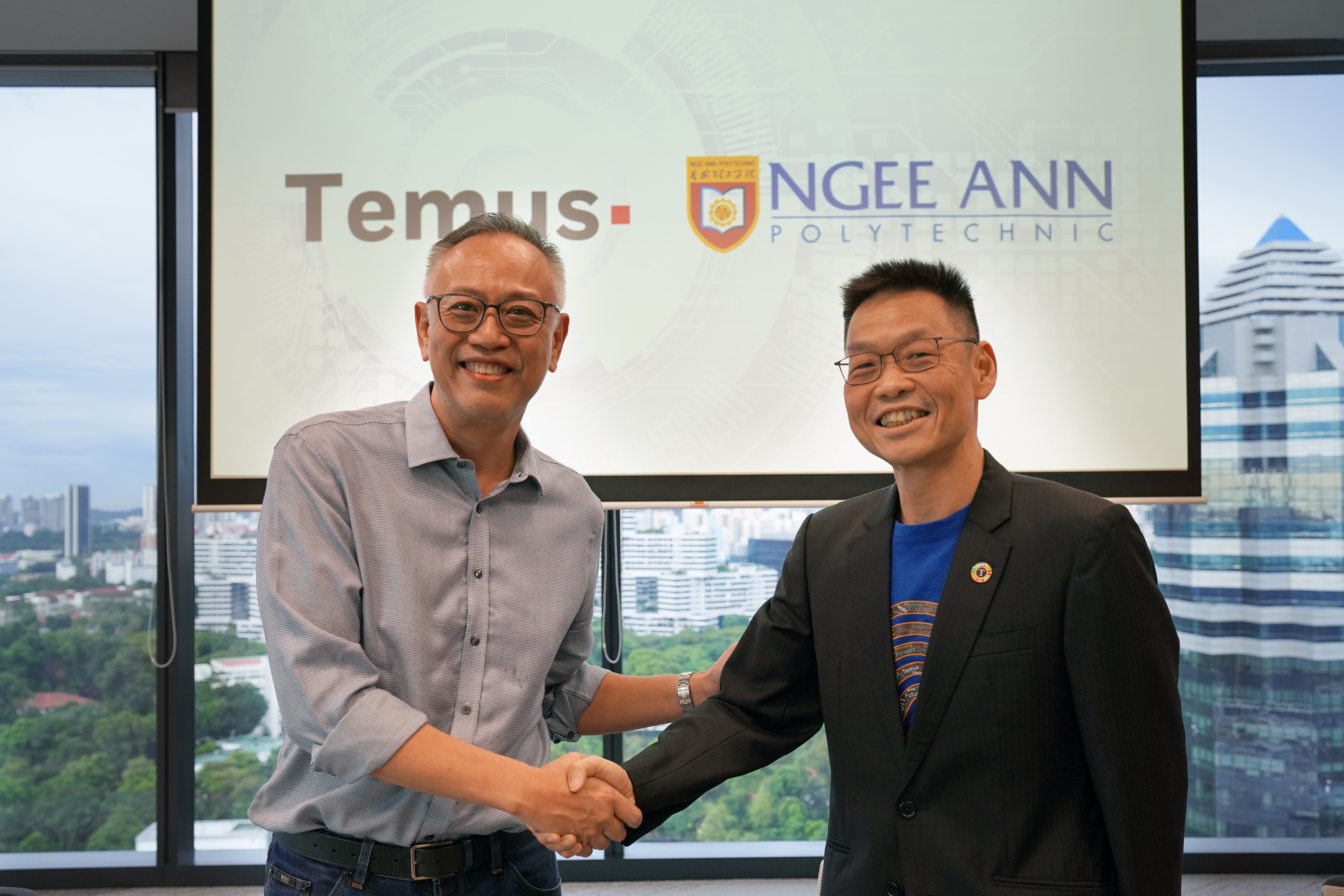 Temus CEO KC Yeoh (right) and Ngee Ann Polytechnic Principal & CEO Lim Kok Kiang launch Digital Factory initiative.