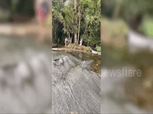 Video: Ngoạn mục cảnh thanh niên  lướt sóng hoành tráng trên thác nước