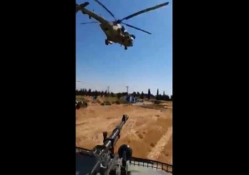 Clip: Trực thăng Nga áp sát, "chạm trán" xe quân sự Mỹ tại Syria