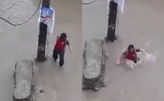 loi pho ngay mua be gai nga xuong ho nuoc xoay roi bi dong lu cuon di xa vai chuc met