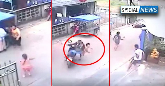 be gai dang chay qua duong thi bat ngo bi chiec xe may lao nhu ten ban tong trung