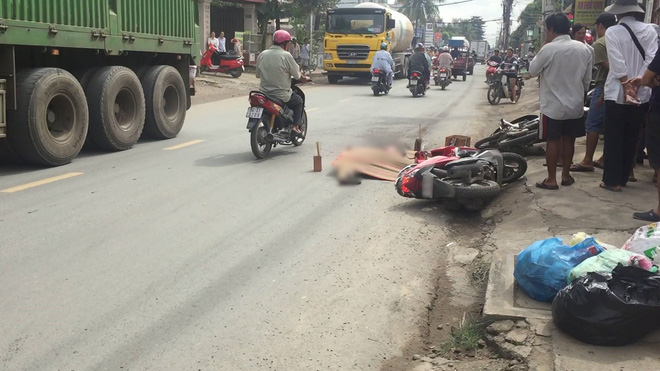 tphcm nga xuong duong sau va cham voi container nguoi dan ong bi banh xe can tu vong