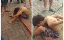 cong an dieu tra clip be trai bi troi chan tay vao goc cay o ha noi