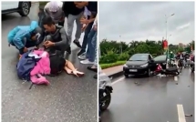 tai xe mo cua bat can khien nguoi phu nu chay xe may bi keo le gan 10m vu tai nan am anh